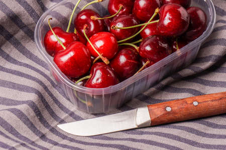 Delicious Fresh red organic Cherry, cherries in a plastic box