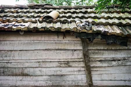 Miserable shack, house. Worn and dilapidated wooden shed. poor housing. Wretched rickety hovel