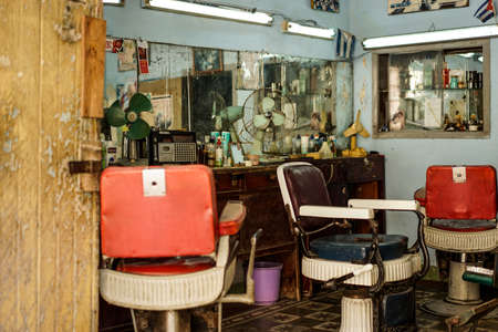 Santiago De Cuba, Cuba - January 10, 2016: Old barber shop in the old quarter, a popular and busy tourist destination in Cubas 2. largest city.のeditorial素材