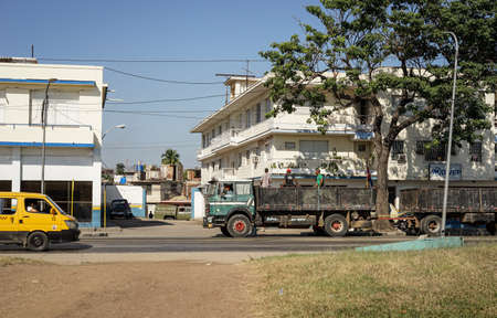 Santiago de Cuba, Cuba - January 11, 2016: Typical scene of one of streets in the center of Santiago de cuba - Colorful architecture, people walking around and vintage american cars in the roads. Santiago is the 2nd largest city in Cubaのeditorial素材