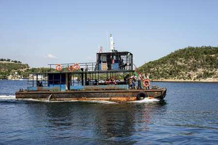 Trinidad, Cuba - January 11, 2016: Old rusty crowded ferry that sails between islands in the bay of Santiago de Cuba on the island's southern partのeditorial素材