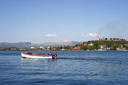 Trinidad, Cuba - January 11, 2016: Man in small fishing boat. Larger fishing boats are not allowed on Cuba because of the risk of island people sailing to the United Statesのeditorial素材
