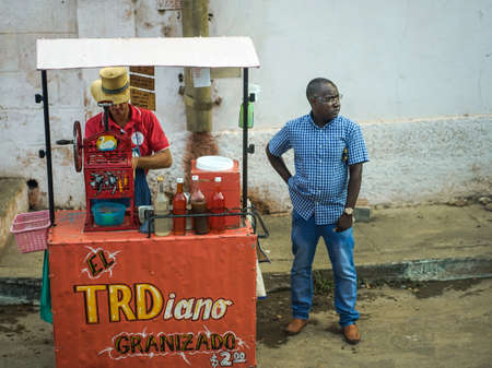 Trinidad, Cuba - January 14, 2016: Street trader who sells Granizado. Slushie street seller. A granizado is an icy beverage of Spain, Central and South America and is a slushie style beverageのeditorial素材
