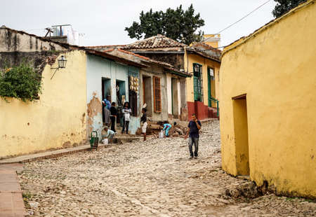 Trinidad, Cuba - January 14, 2016: Typical scene of one of streets in the center of Trinidad, Cuba - colonial architecture, people walking around,のeditorial素材