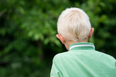 The head of the little blond boy in the Gardenの写真素材