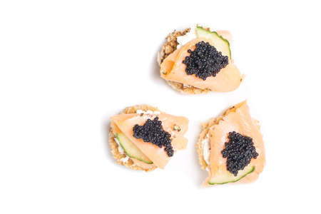 Smoked Salmon Appetizer with Cream Cheese and Caviar isolated on whiteの写真素材