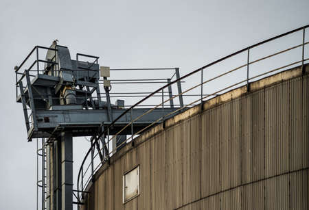 Industrial silos. Tall and with grey craneの写真素材