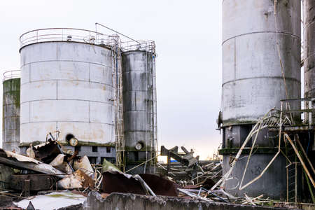 degradation of industrial materials, destroyed silos, twisted metal, decompositionの写真素材