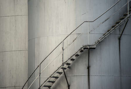 Industrial silos with external staircase, close up