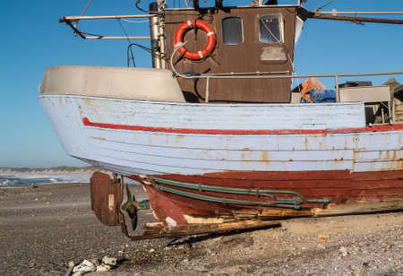 Fishing village with the old wooden fishing boats pulled up on the beachの写真素材