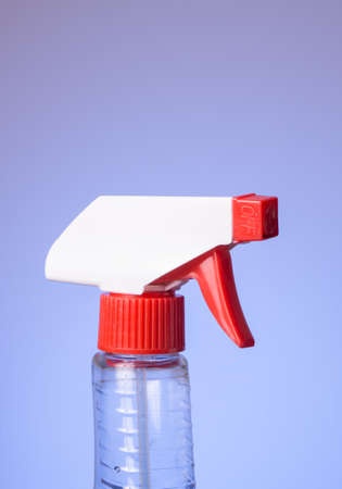Top of squeeze spray bottle isolated on bluish backgroundの写真素材