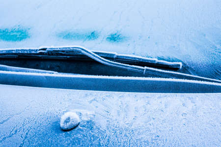 Iceflowers, frozen.The ice-cold frost forms ice crystals in beautiful unique patterns on the window, Hood and wiper on the Carの写真素材