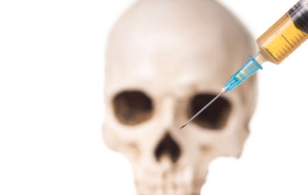 Blurry Skull and syringe with liquid substans, isolated on whte backgroundの写真素材