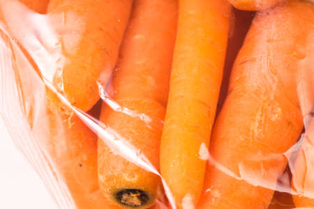 Bunch of organic Carrots packaged in plastic bagの写真素材