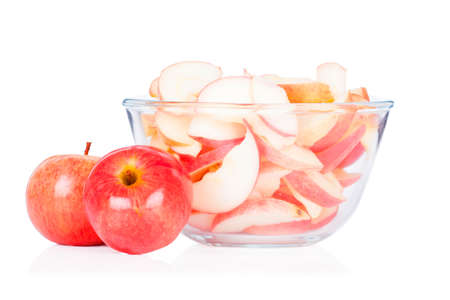 bir red apples with glass bowl isolated on white backgroundの写真素材