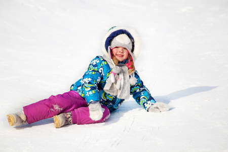 Winter activity  little child having fun in the snowの写真素材