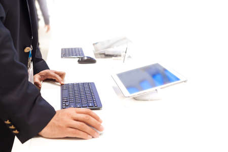 Businessman working on a tablet pc with additional keyboard