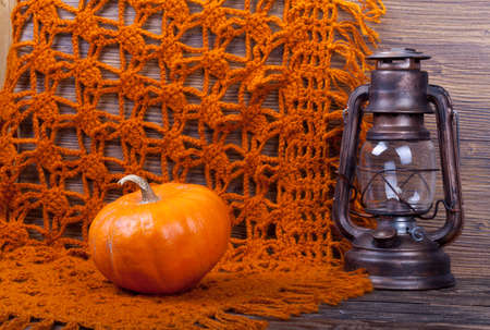 Traditional knitted woolen female shawl on wooden backgroundの写真素材