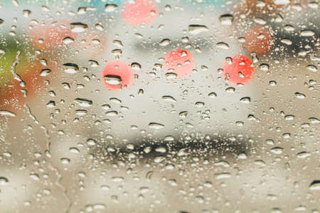 Abstract traffic in raining day. View from car seatの写真素材