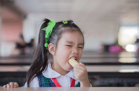 Students eat snacksの写真素材