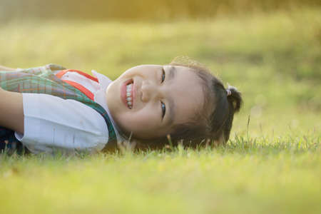 Happy little girl  in school uniformhaving fun at the school