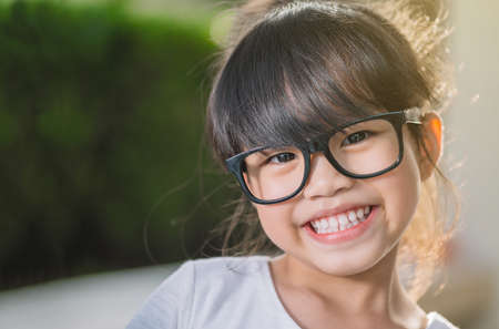Beautiful girl at the park looking very happy