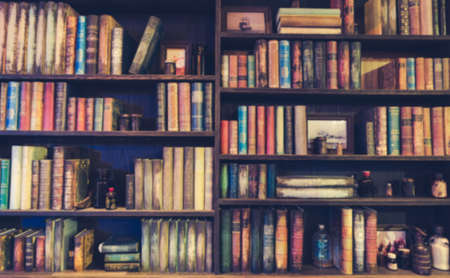 blurred Image Many old books on bookshelf in library