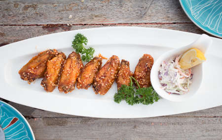 Sticky Chinese Chicken Wings with soy sauce and sesameの写真素材