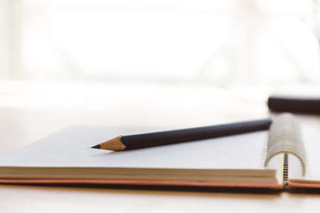 a blank reporters notepad notebook with pencilの写真素材