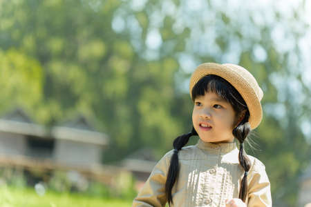 portrait asia children feeling happy of sunlightの写真素材