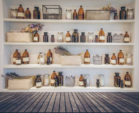Spa collage series ,wood table shelf Bottle of massage oil in spaの写真素材