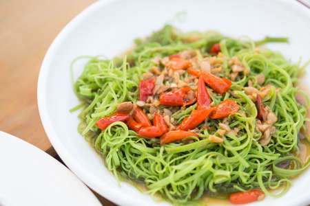 Quick fried water spinach with chili and soy sauceの写真素材