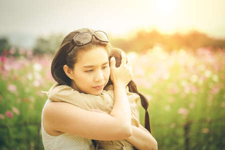 concept of family. mother and child daughter outdoors in summer  / Grain texture addedの写真素材