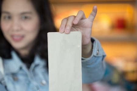 Asian girl hand show blank paperの写真素材