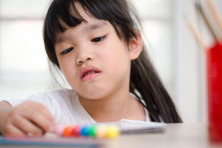 asia children  exasperated with his homeworkの写真素材