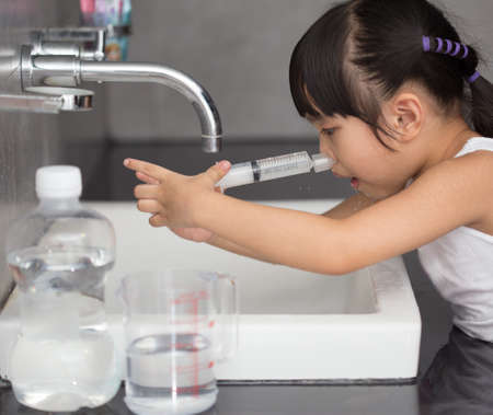 A sick children Saline nasal washの写真素材