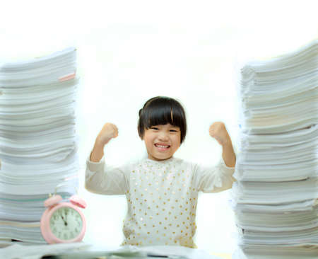 Happy little girl and early education. little kids doing his homework for fun and learning  on white backgroundの写真素材