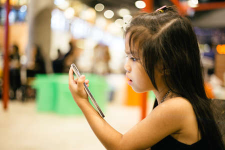 Asian girl are using the smart phoneの写真素材