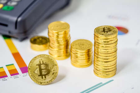 Bitcoin BTC coins on financial chart 2017の写真素材