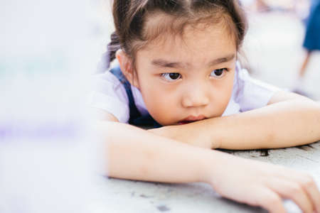 Student girl outdoor unhappy  going back to schoolの写真素材
