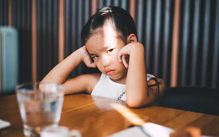 Portrait of child little angry girlの写真素材