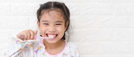 Little asian cute girl brush teethの写真素材