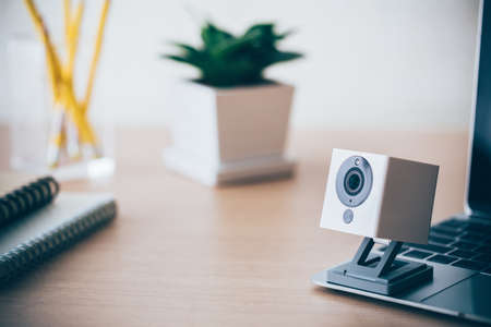 Security camera on Wood table. IP Camera.