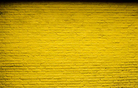 Texture old Yellow wall backgroundの写真素材