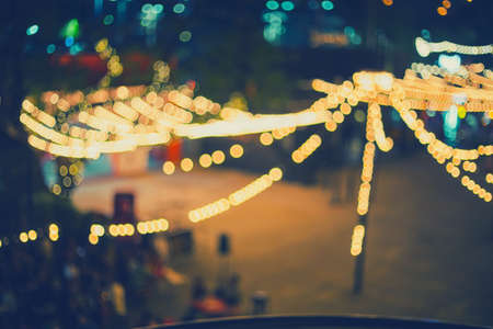 Abstract image light bokeh of Night Festival on street for background usage.