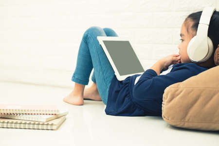 Wireless router and kids using a Tablet in home.の写真素材