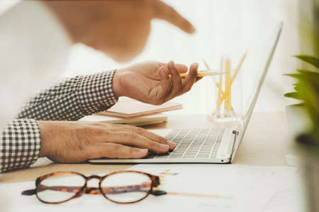 Teamwork concept.Young creative managers team working with new startup project in  officeの写真素材