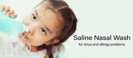 young Asian girl Sick kids cleaning nose with Nasal irrigationの写真素材
