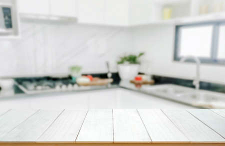 Wood table top on blurred kitchen background,の写真素材