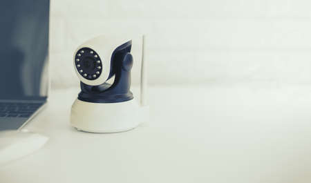 Security camera on white table. IP Camera.の写真素材